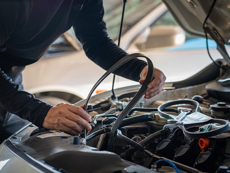 Service employee working on a car